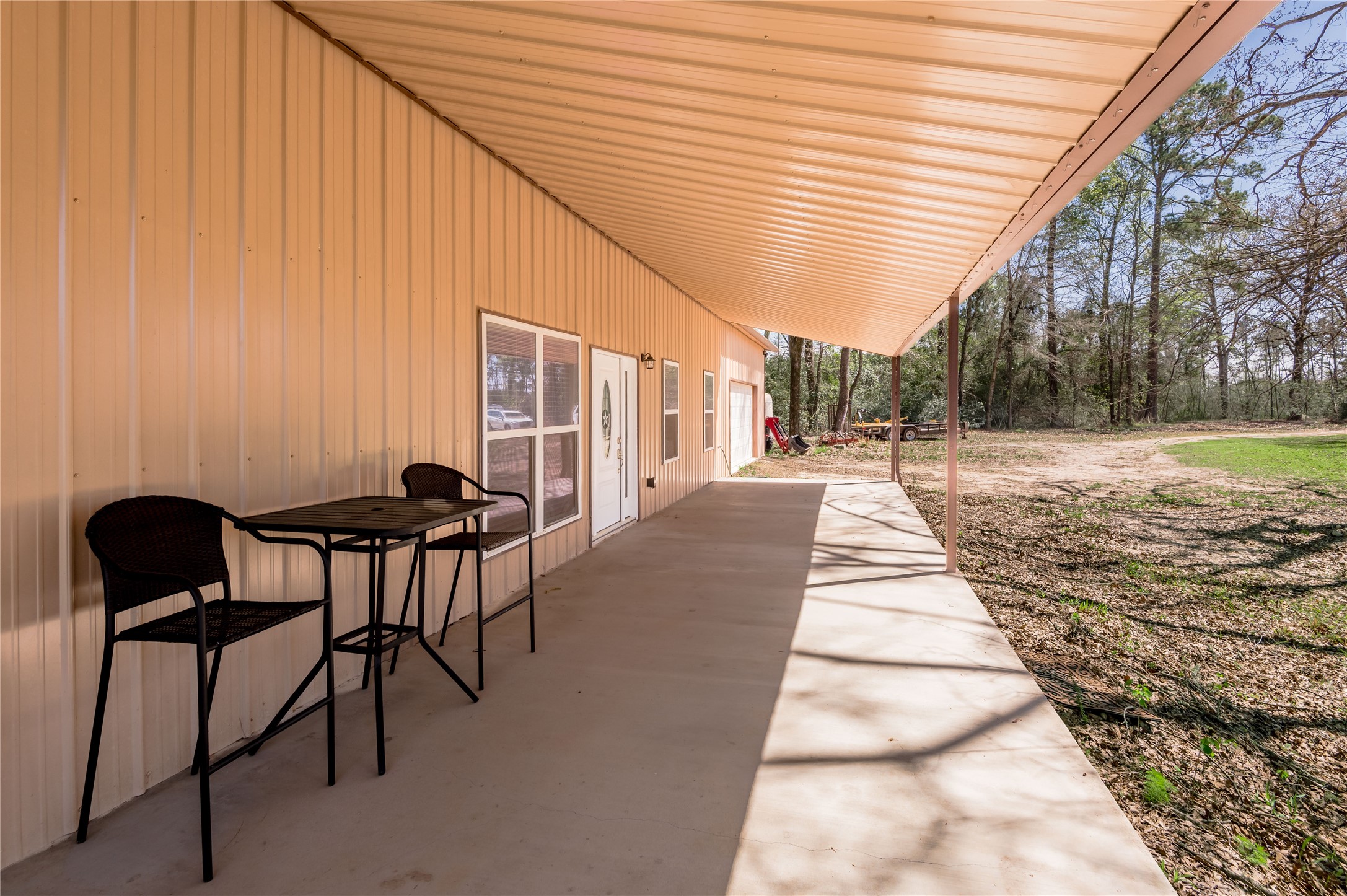 1533 Kickapoo Road Groveton, TX 75845 - Photo 5 of 50 a backyard of a house with table and chairs