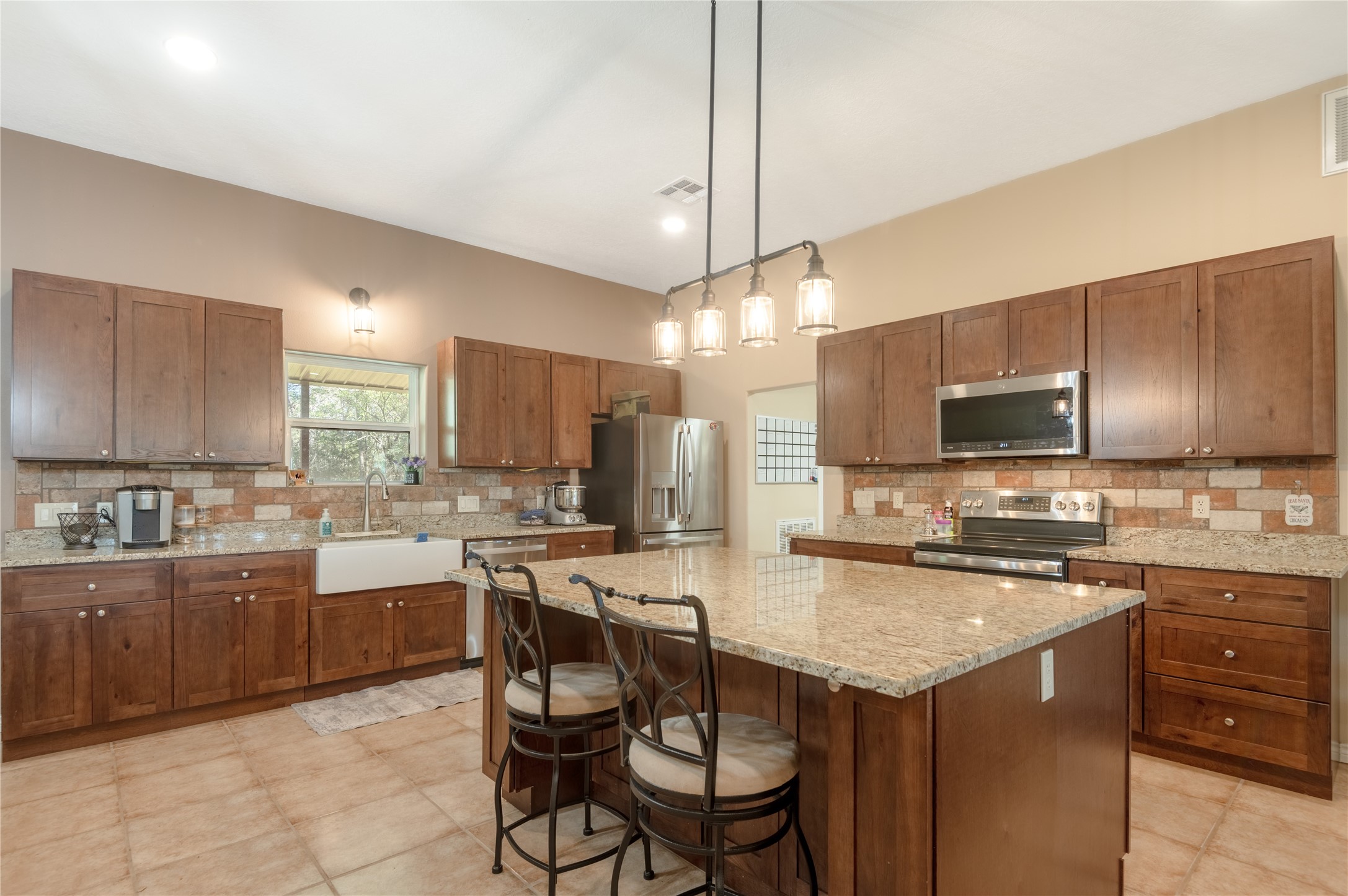 1533 Kickapoo Road Groveton, TX 75845 - Photo 9 of 50 a kitchen with lots of counter top space and appliances
