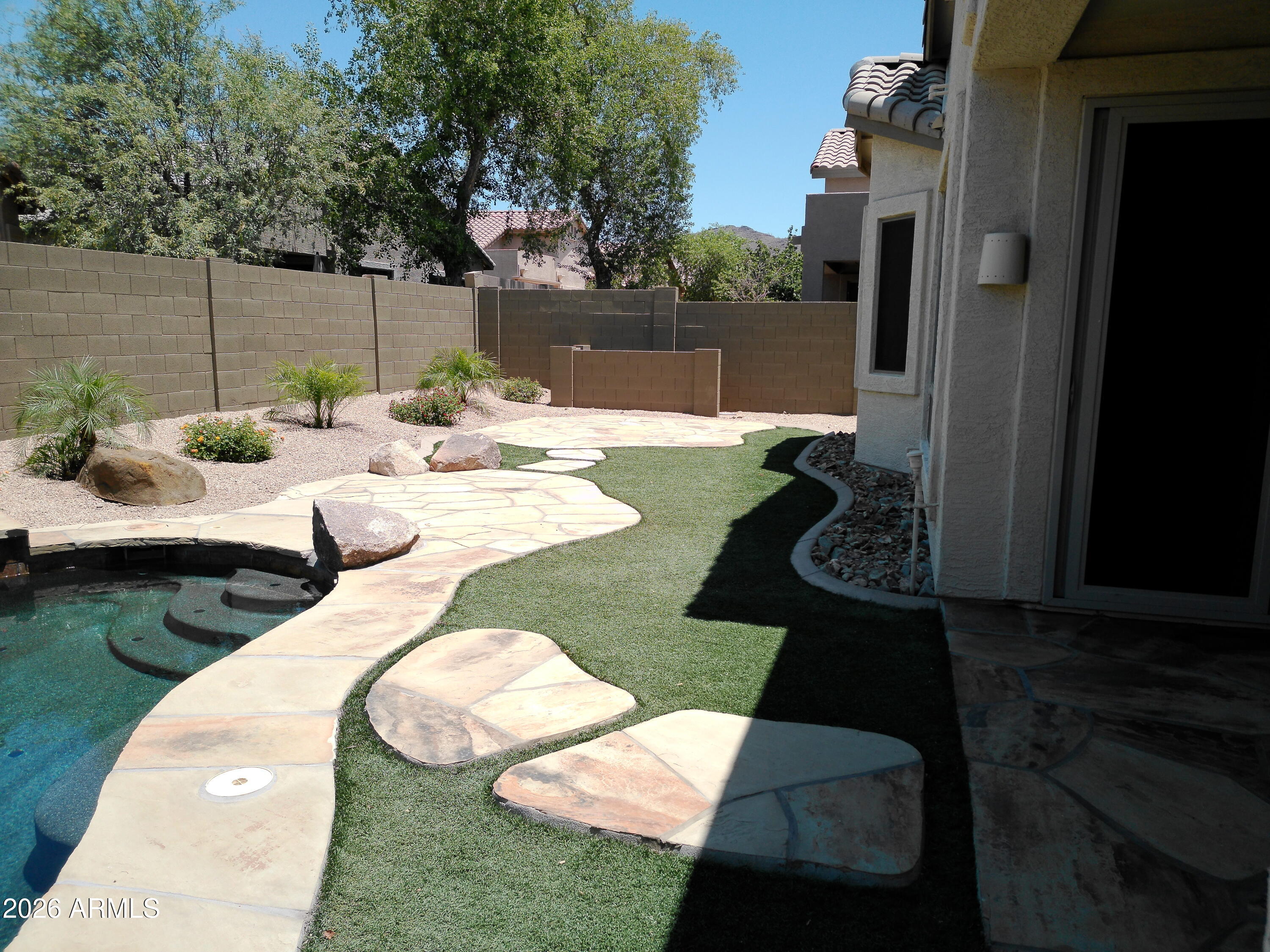 3018 West Sentinel Rock Road Phoenix, AZ 85086 - Photo 7 of 16 a view of swimming pool with seating space