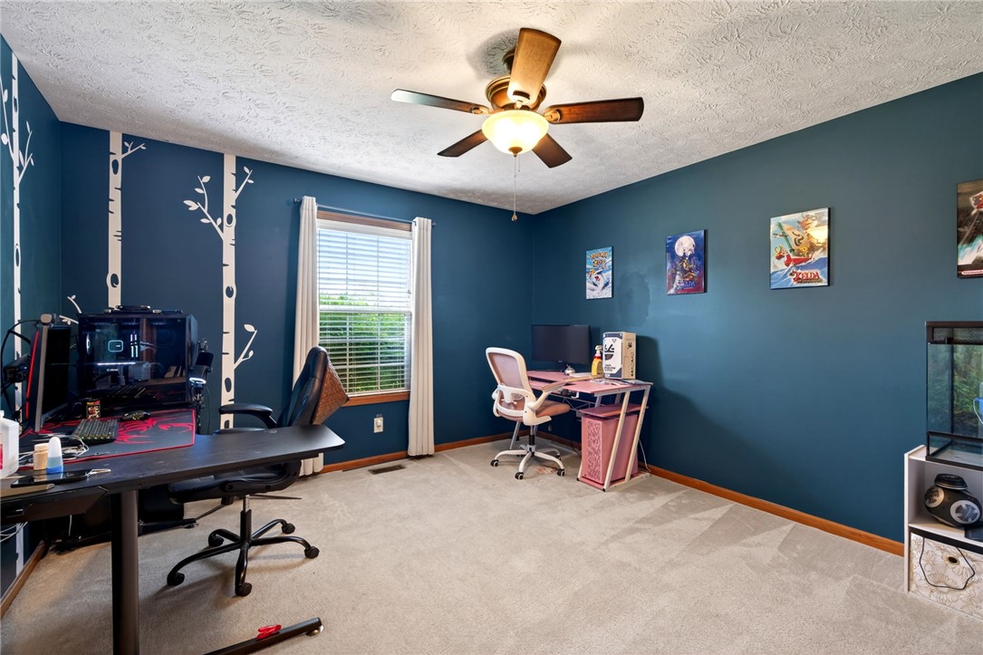 4996 Shannon Avenue Springfield, OH 45504 - Photo 8 of 61 This cozy space features a bright window and textured ceilings, ideal for a quiet retreat.