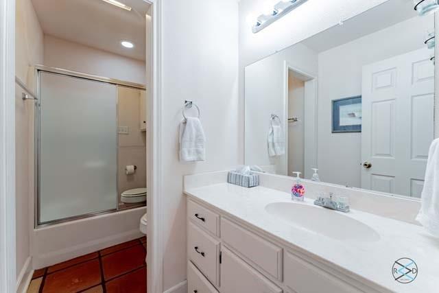 6209 Point La Vista Road Malakoff, TX 75148 - Photo 20 of 38 a bathroom with a shower sink vanity and mirror