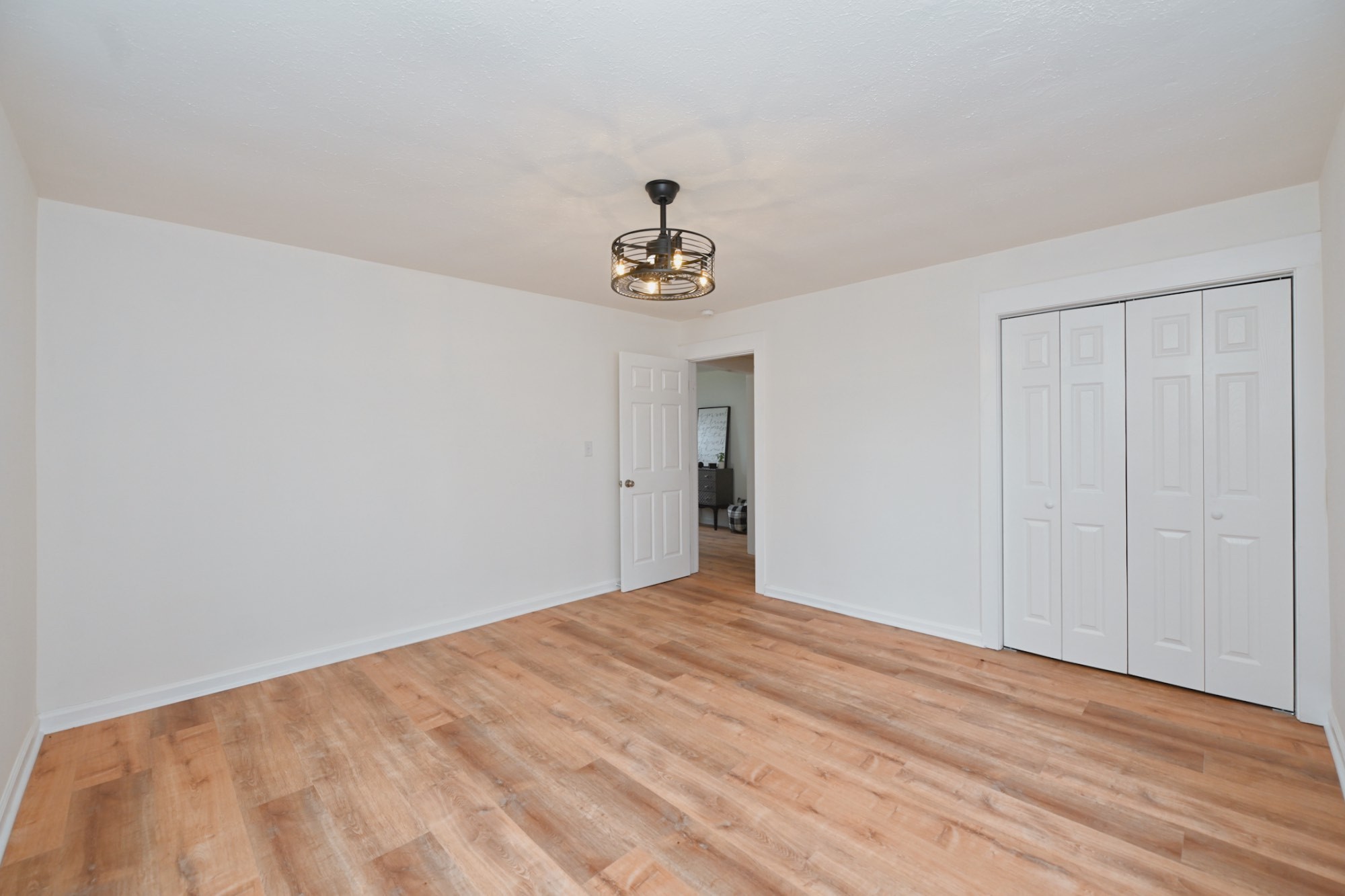 116 North Walnut Street Springfield, TN 37172 - Photo 11 of 17 a view of a room with wooden floor and ceiling fan