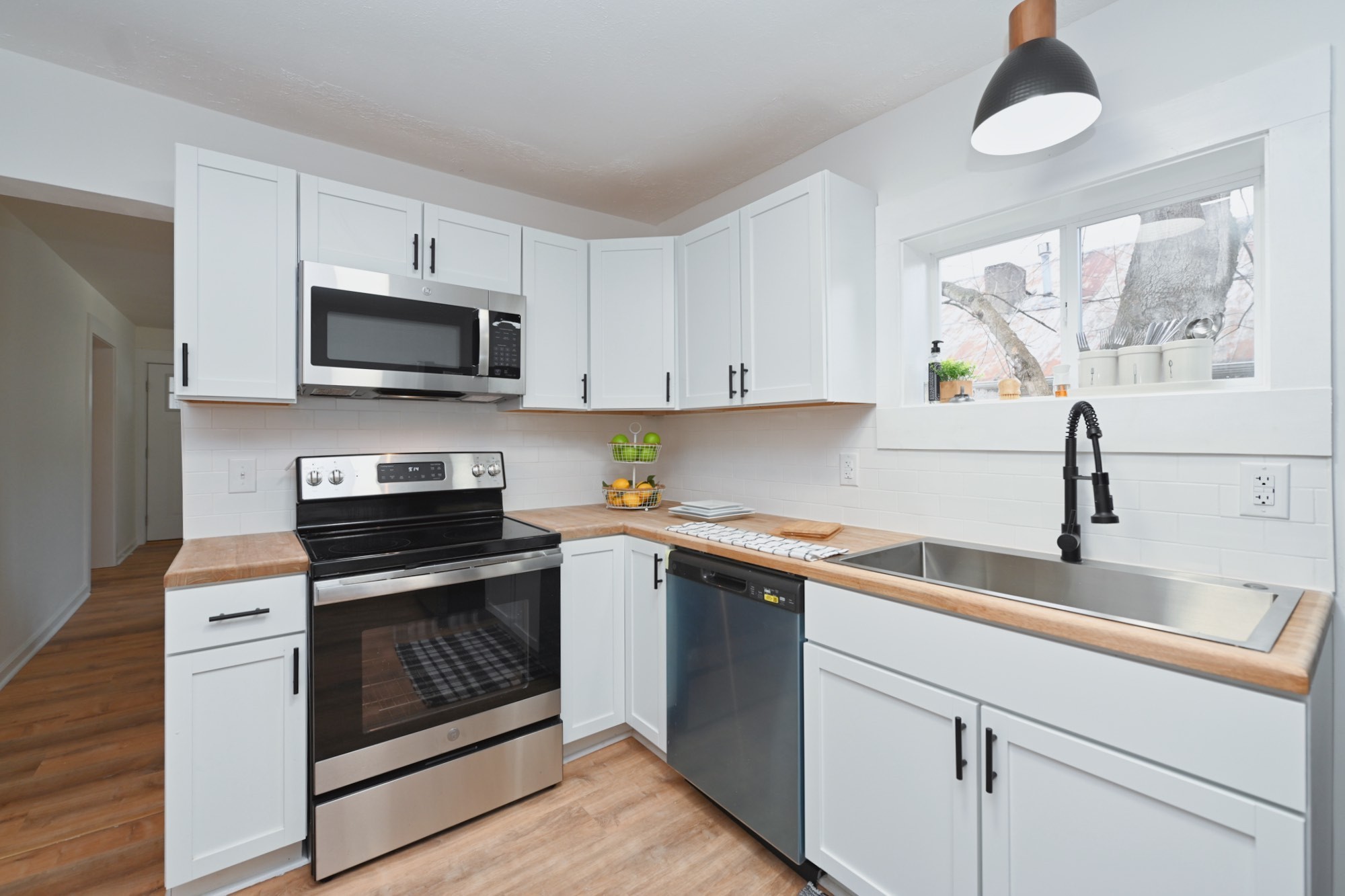 116 North Walnut Street Springfield, TN 37172 - Photo 3 of 17 a kitchen with cabinets stainless steel appliances a sink and a counter top space