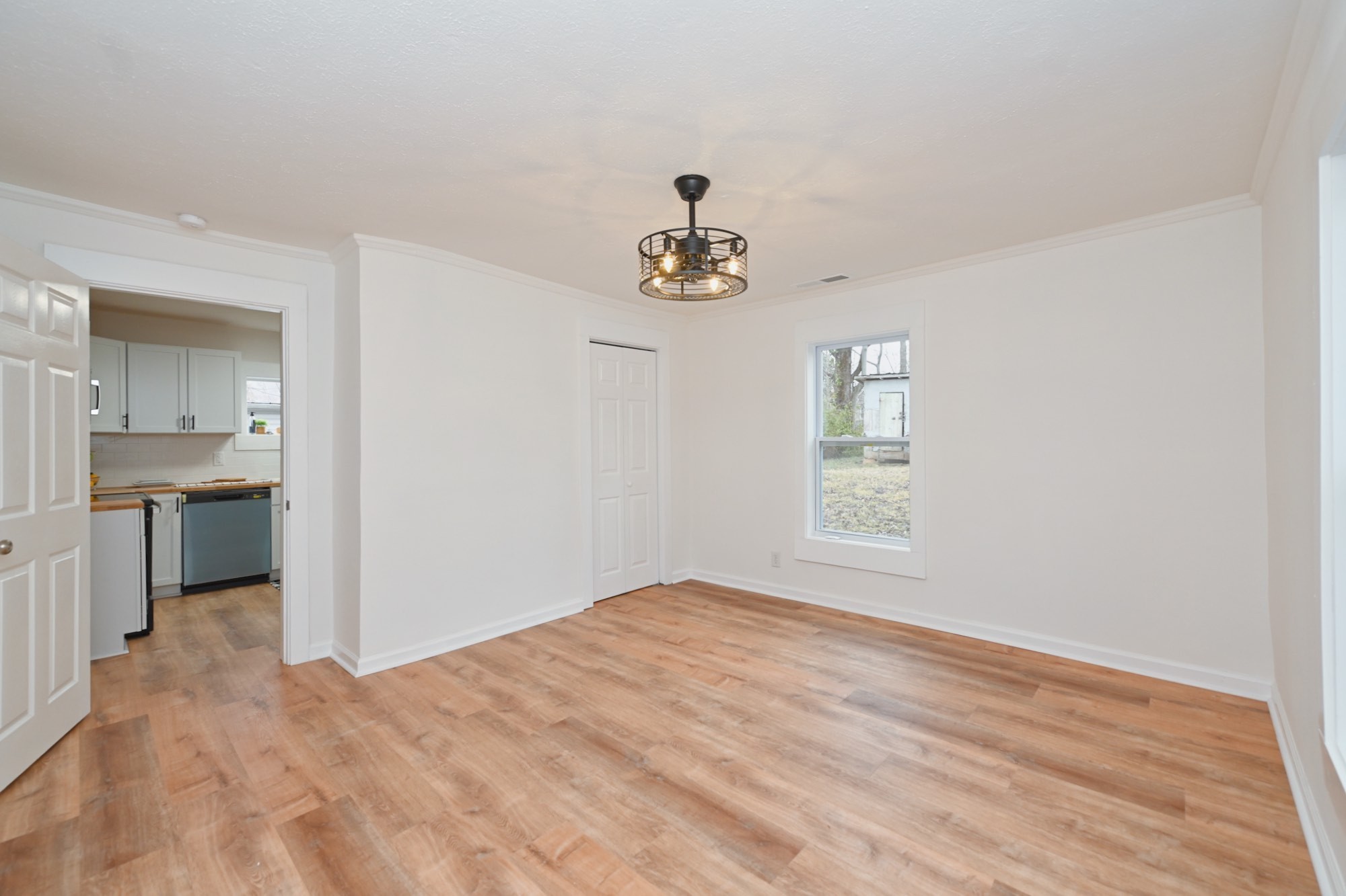116 North Walnut Street Springfield, TN 37172 - Photo 8 of 17 a view of empty room with wooden floor and window