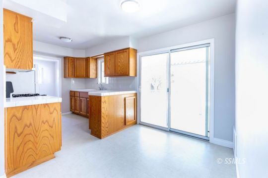 1604 Ewing Circle Ridgecrest, CA 93555 - Photo 5 of 19 a kitchen with stainless steel appliances granite countertop a refrigerator and a stove