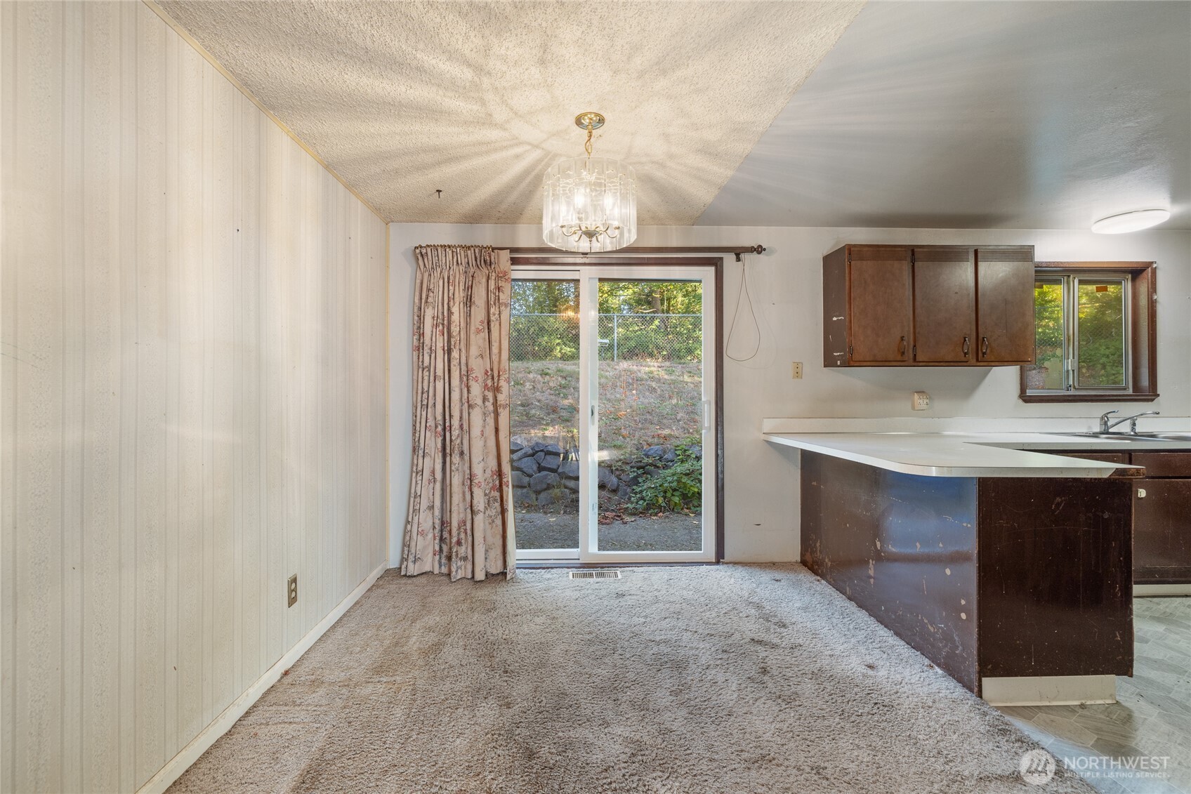 20822 Southeast 271st Street Covington, WA 98042 - Photo 13 of 30 a view of an empty room with window and cabinet