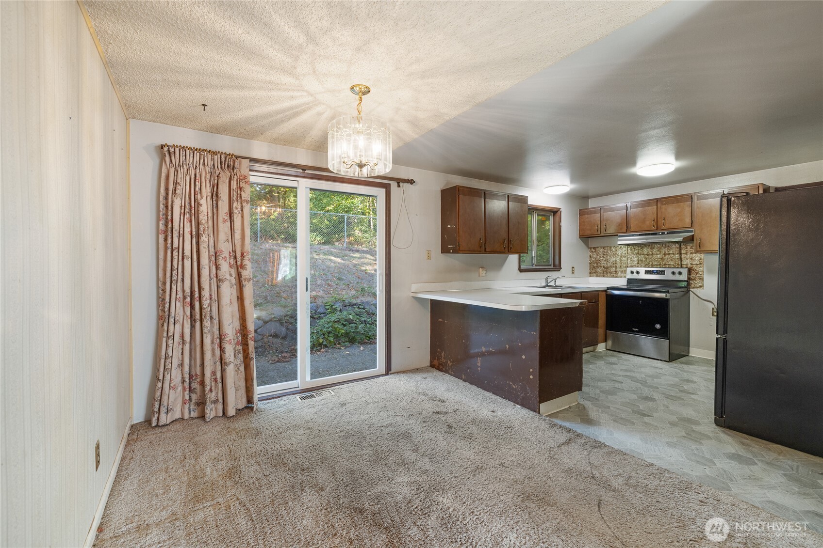 20822 Southeast 271st Street Covington, WA 98042 - Photo 14 of 30 a kitchen with kitchen island granite countertop a sink appliances and cabinets