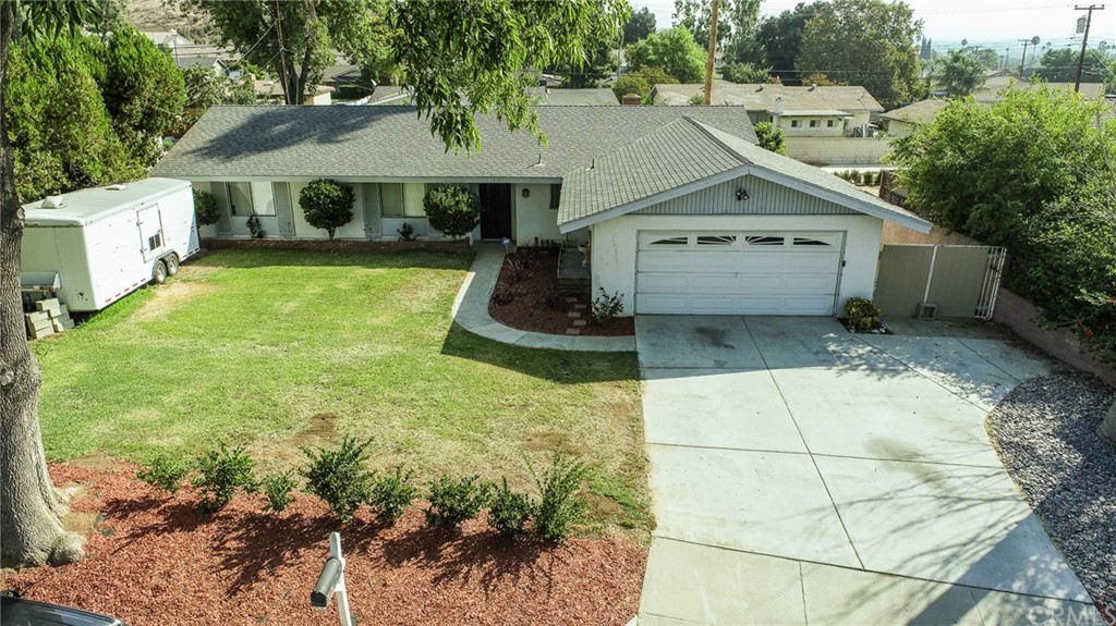 5353 Peacock Lane Riverside, CA 92505 - Photo 1 of 1 a front view of a house with a yard