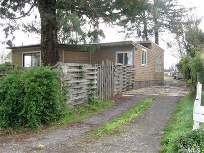 5275 Todd Road Sebastopol, CA 95472 - Photo 1 of 1 a front view of a house with garden