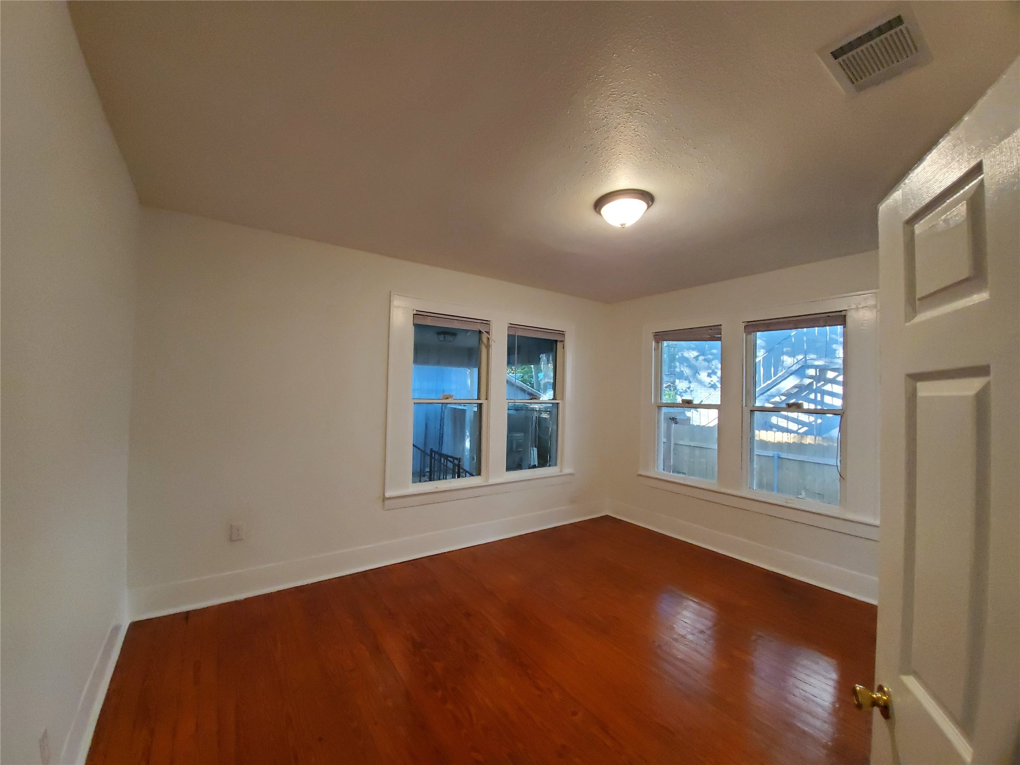 4113 Speedway Austin, TX 78751 - Photo 11 of 31 Rich hardwood floors and classic wood-framed windows anchor this versatile, light-filled space.