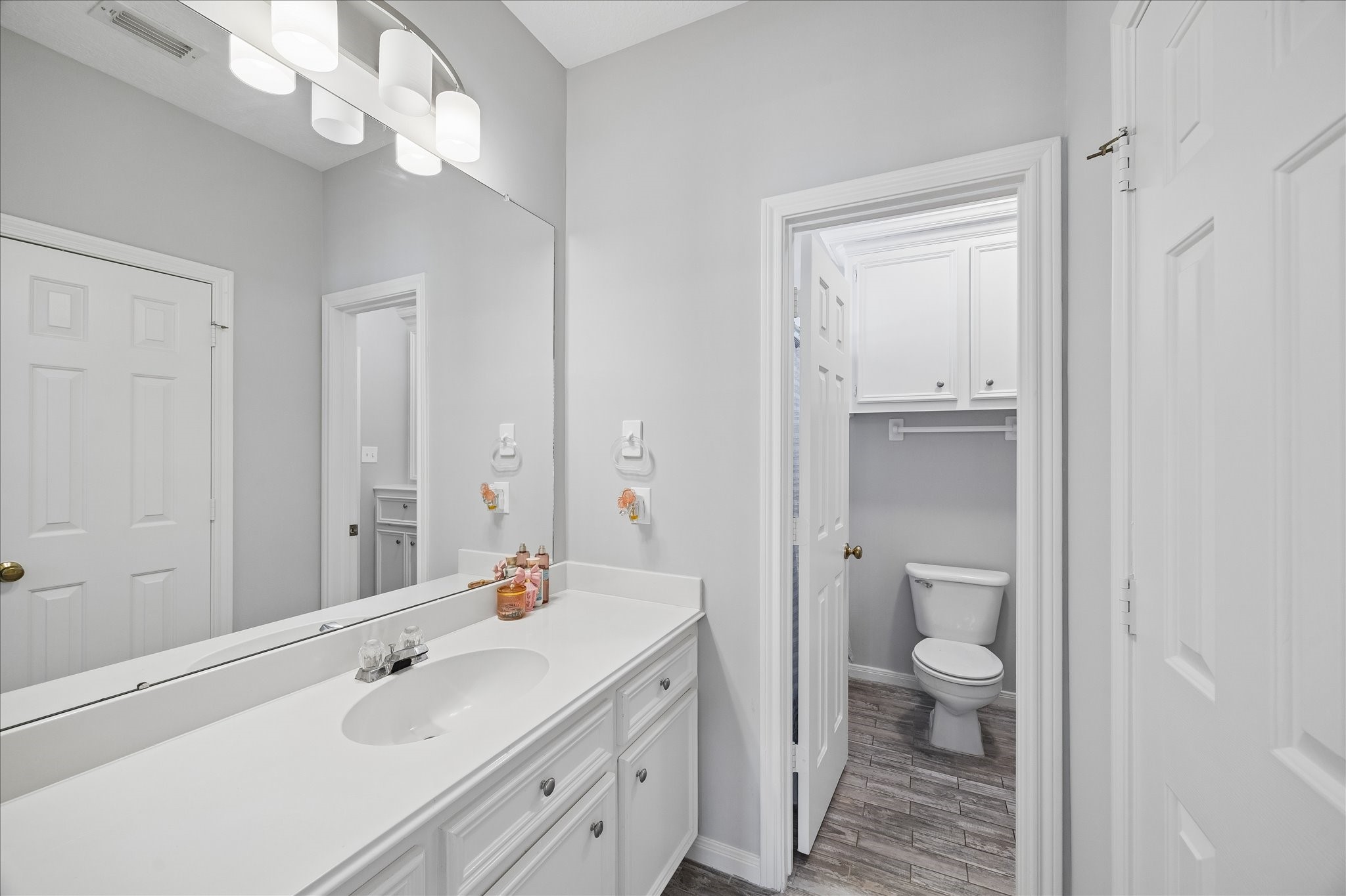 2810 Timber Country Way Kingwood, TX 77345 - Photo 26 of 30 a spacious bathroom with a sink a toilet and a large mirror