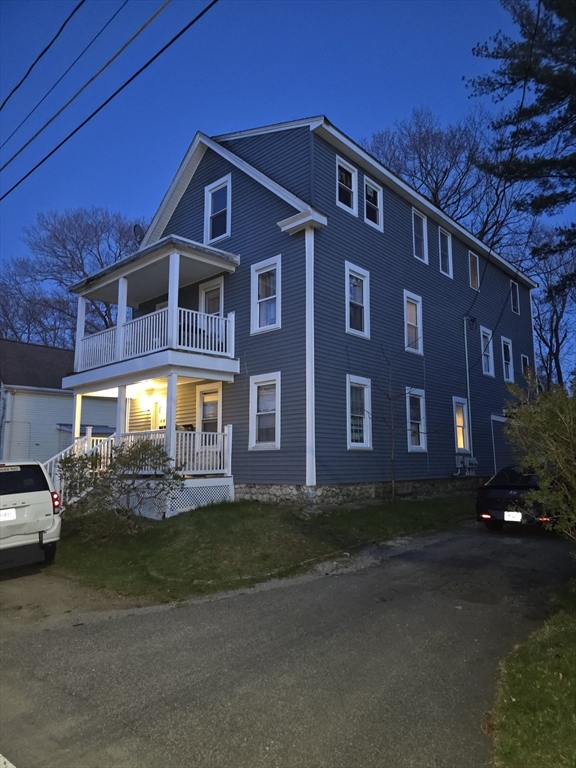 184 Myrtle Street Brockton, MA 02301 - Photo 2 of 10 a front view of a house with a yard