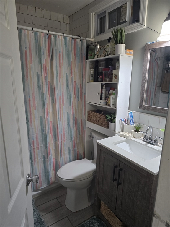 184 Myrtle Street Brockton, MA 02301 - Photo 3 of 10 a bathroom with a sink a toilet and shower