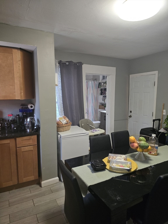 184 Myrtle Street Brockton, MA 02301 - Photo 5 of 10 a dining room with furniture and wooden floor