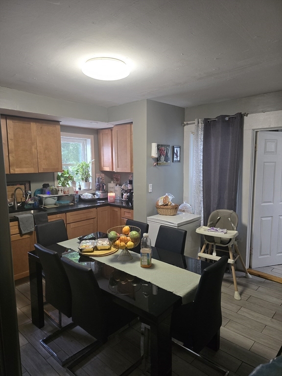 184 Myrtle Street Brockton, MA 02301 - Photo 6 of 10 a living room with furniture kitchen view and a window