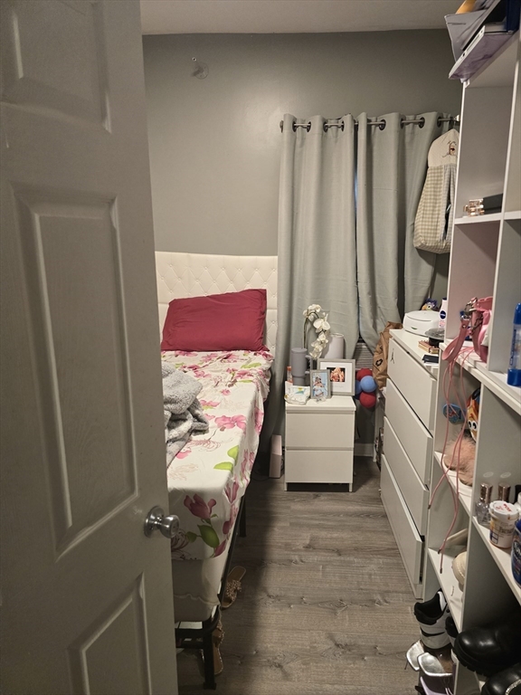 184 Myrtle Street Brockton, MA 02301 - Photo 8 of 10 a bedroom with a bed and a couch
