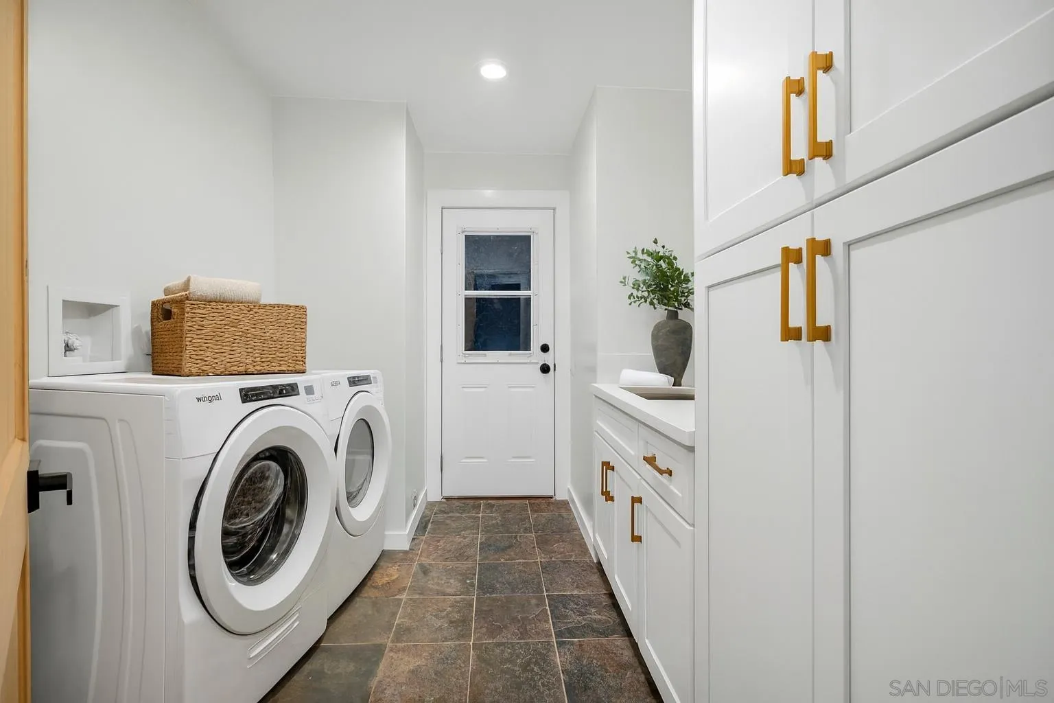 1590 Dorothea Avenue Fallbrook, CA 92028 - Photo 15 of 42 a hallway with white cabinets