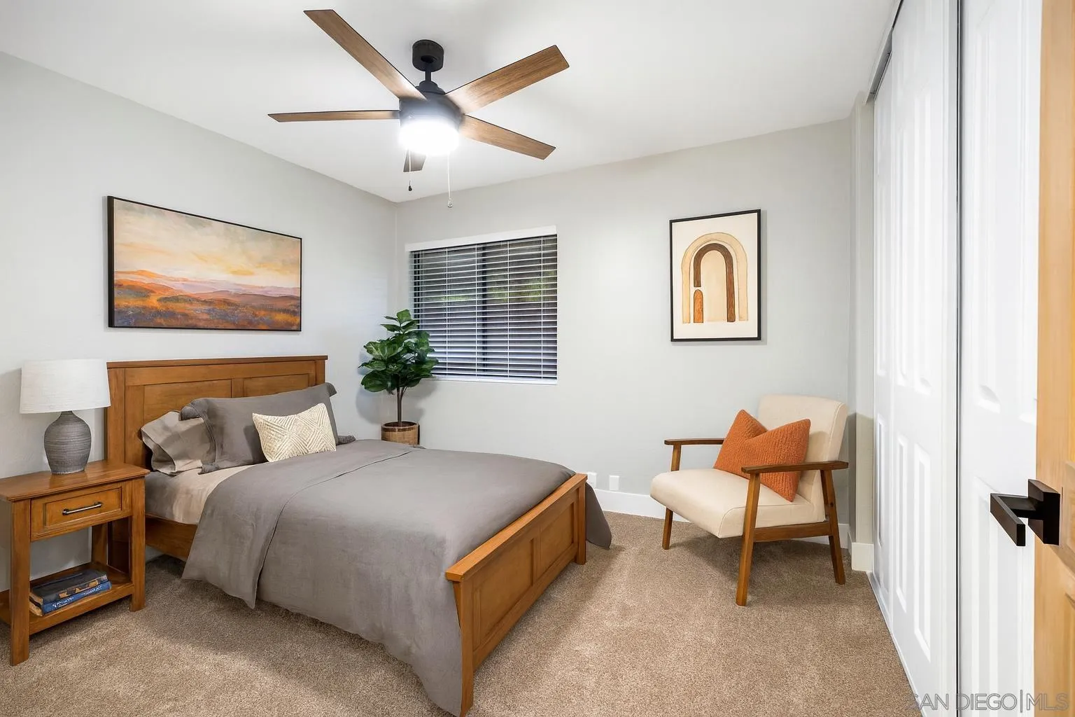 1590 Dorothea Avenue Fallbrook, CA 92028 - Photo 18 of 42 a bedroom with a bed and a chandelier