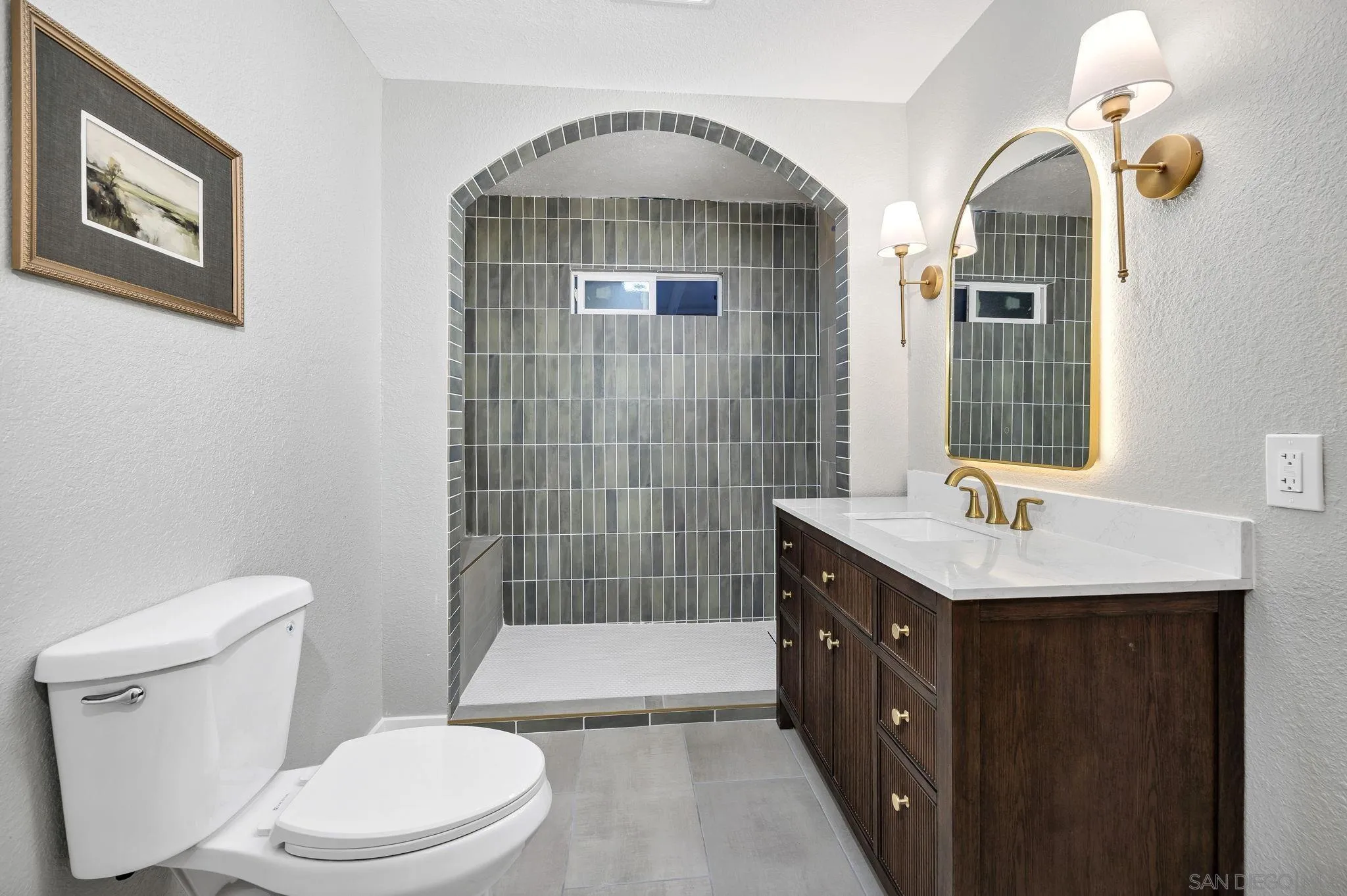 1590 Dorothea Avenue Fallbrook, CA 92028 - Photo 19 of 42 a bathroom with a double vanity sink toilet and shower