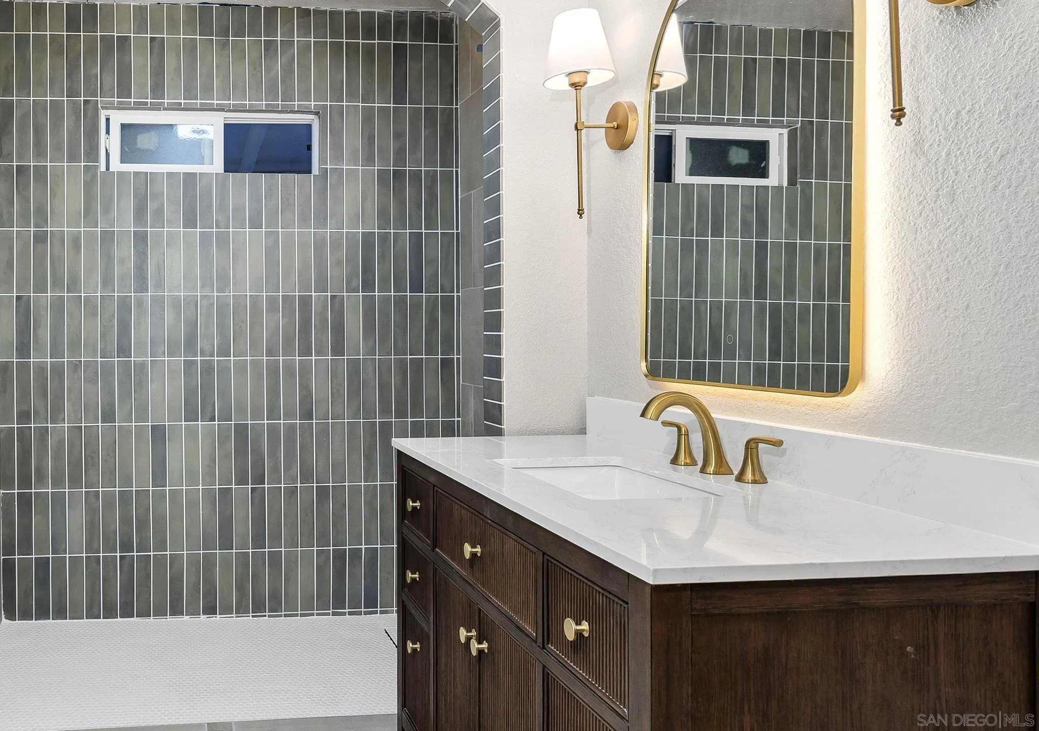 1590 Dorothea Avenue Fallbrook, CA 92028 - Photo 20 of 42 a bathroom with a sink and a shower