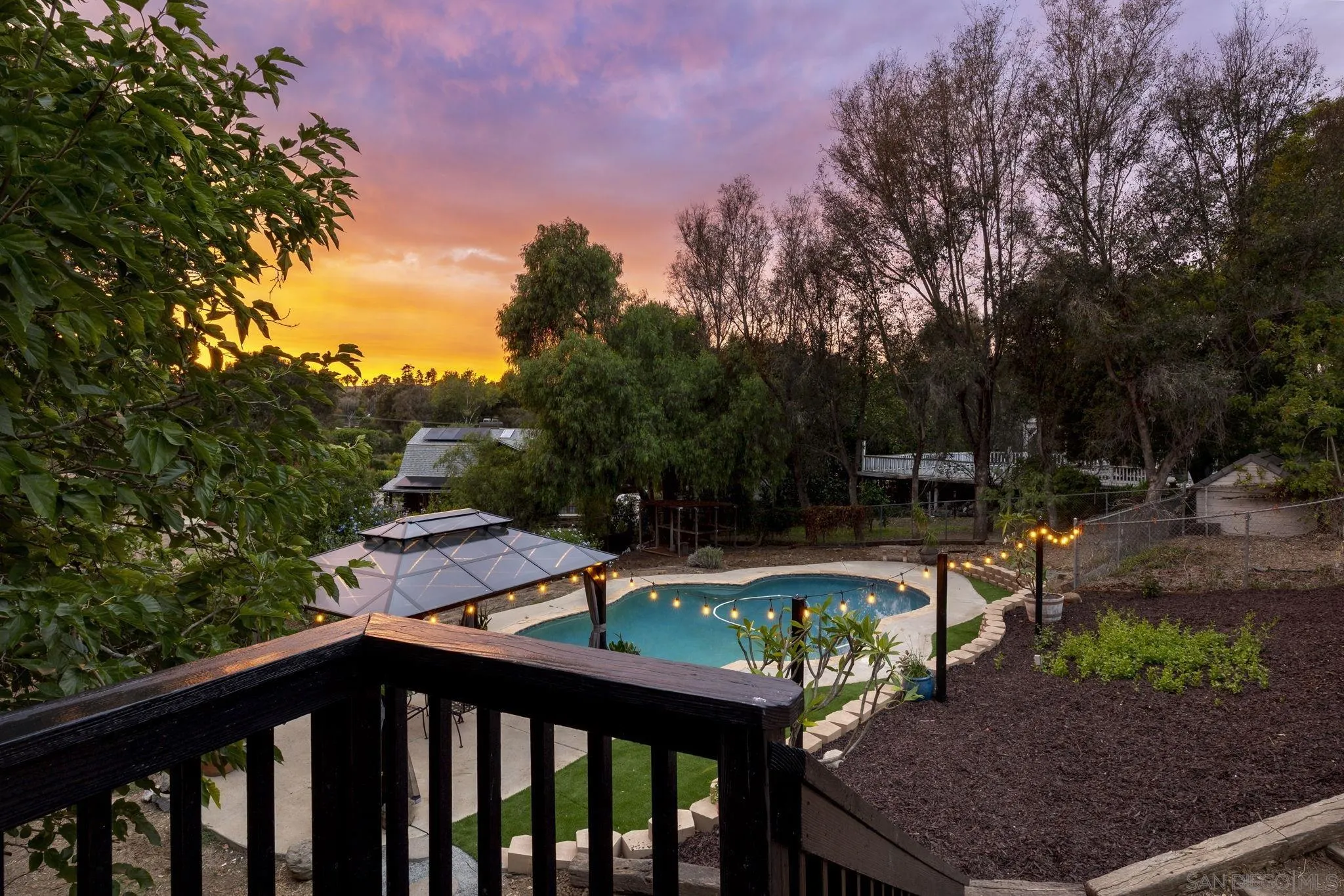 1590 Dorothea Avenue Fallbrook, CA 92028 - Photo 28 of 42 a balcony with wooden floor outdoor seating and trees
