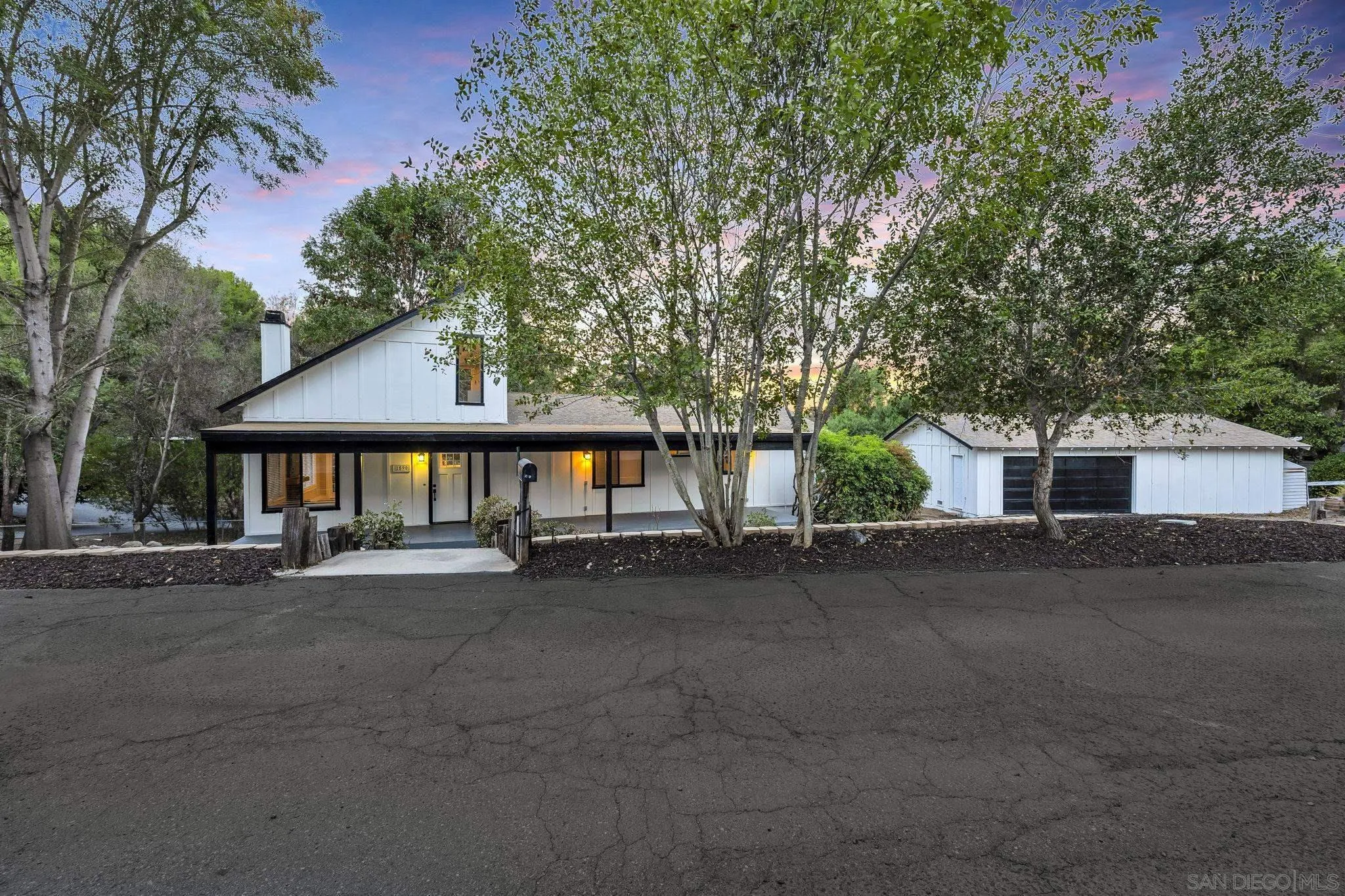 1590 Dorothea Avenue Fallbrook, CA 92028 - Photo 3 of 42 a front view of a house with yard and trees