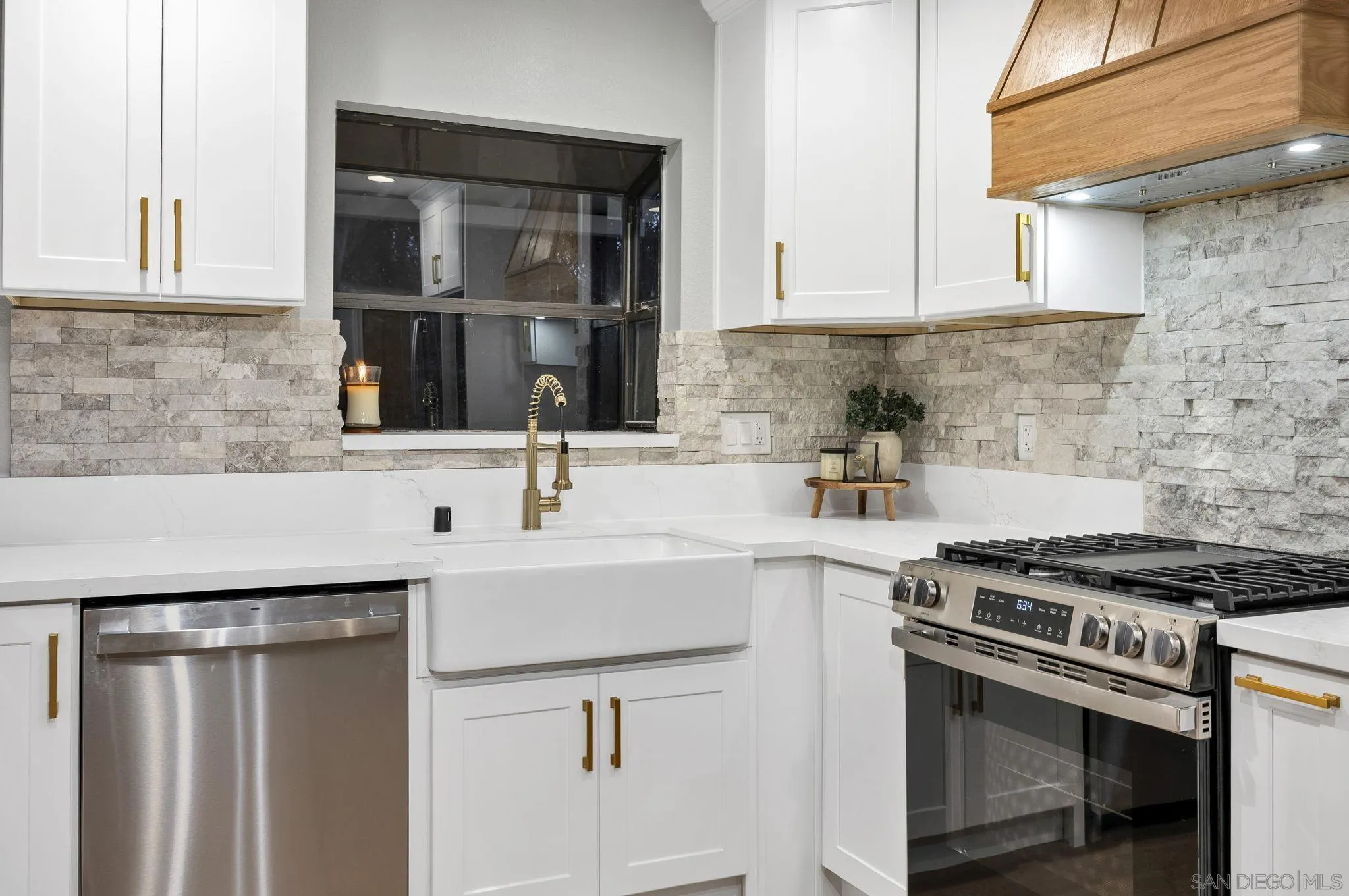 1590 Dorothea Avenue Fallbrook, CA 92028 - Photo 8 of 42 a kitchen with stainless steel appliances a sink and cabinets