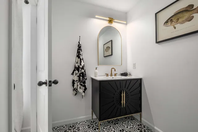 a bathroom with a sink and mirror