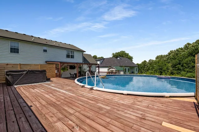 a view of a swimming pool with a lounge chairs
