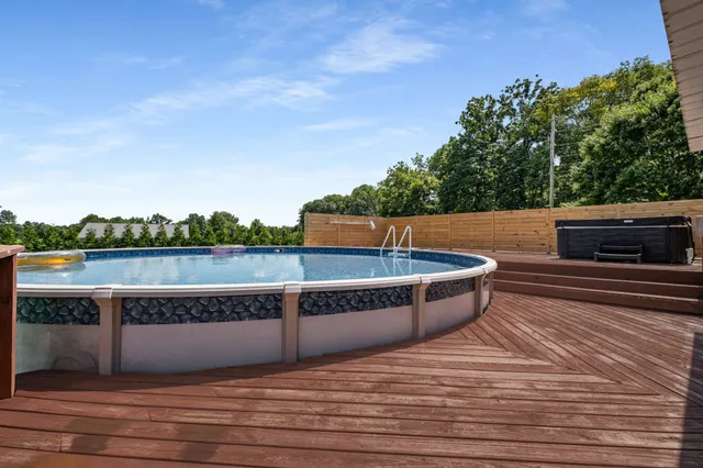 an outdoor space with furniture and garden