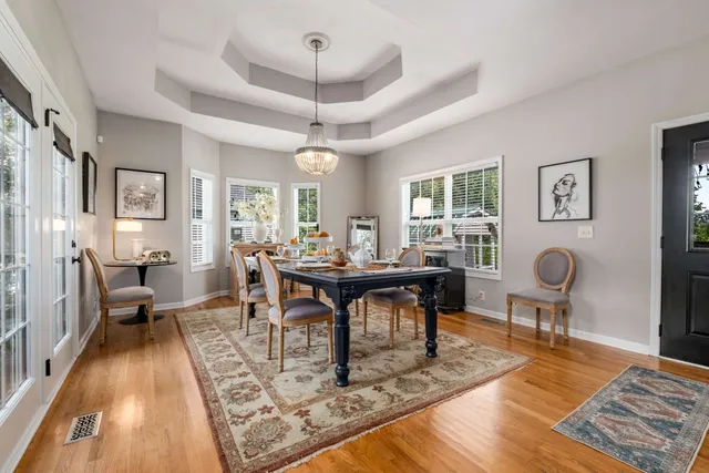 a view of a dining room with furniture window and wooden floor