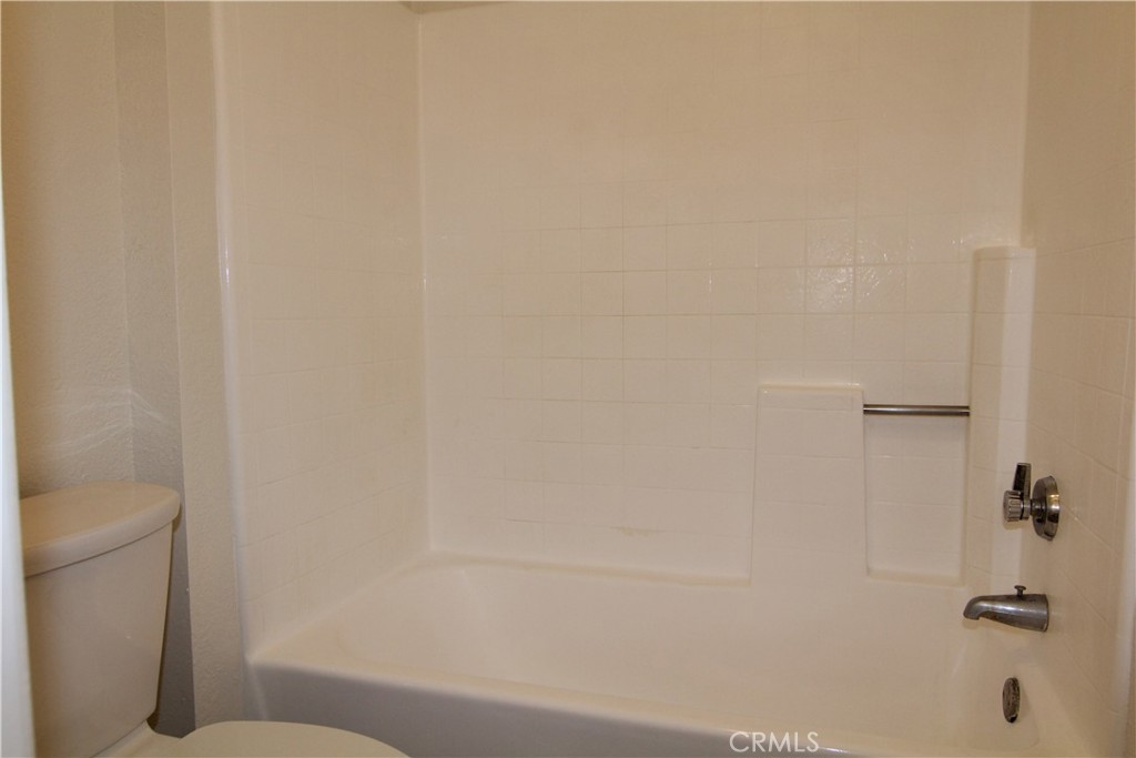 955 East 3rd Street, Unit 204 Long Beach, CA 90802 - Photo 16 of 37 a bathroom with a shower and a toilet