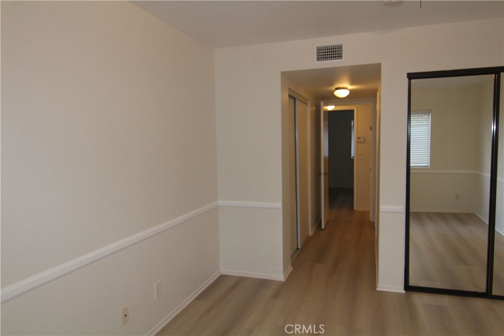 955 East 3rd Street, Unit 204 Long Beach, CA 90802 - Photo 21 of 37 a view of a hallway with wooden floor
