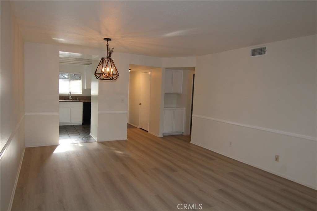 955 East 3rd Street, Unit 204 Long Beach, CA 90802 - Photo 7 of 37 wooden floor in an empty room with a window