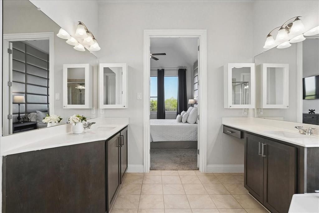 2721 Rotherham Street Prosper, TX 75078 - Photo 16 of 37 a en suite bathroom with a bathtub sink and mirror