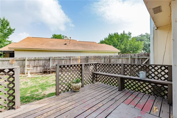 a view of a roof deck with wooden floor