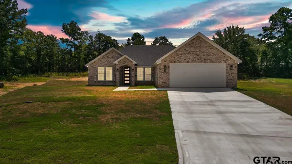 a front view of a house with yard