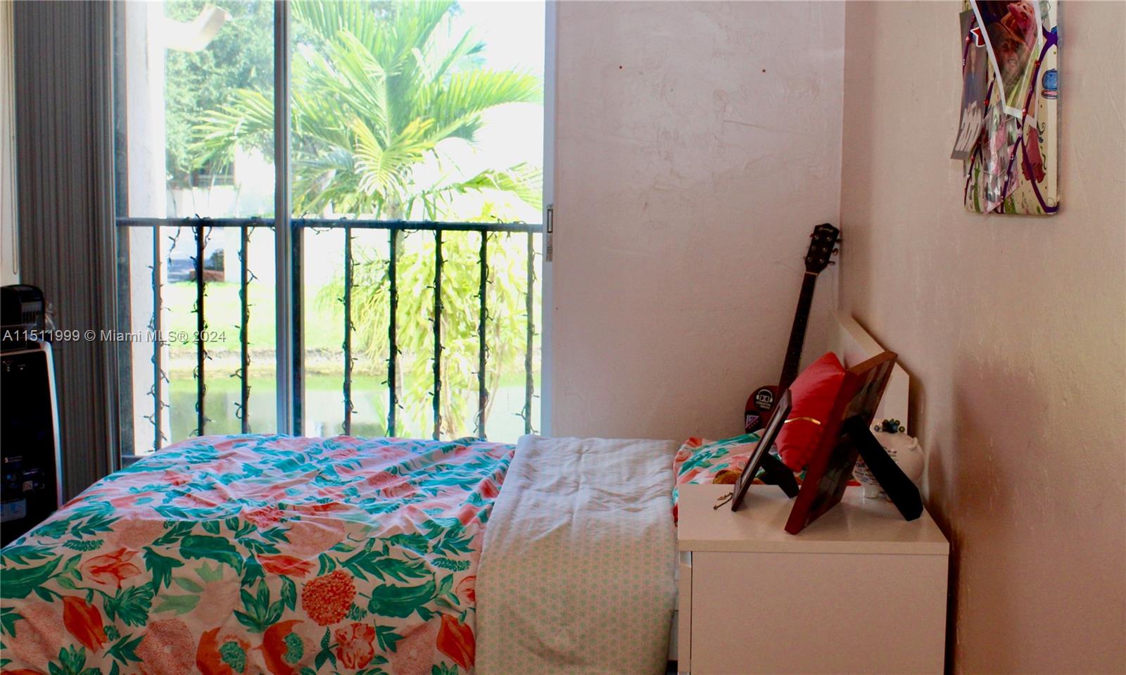 10433 Southwest 80th Street Miami, FL 33173 - Photo 15 of 24 a bedroom with a bed and a window