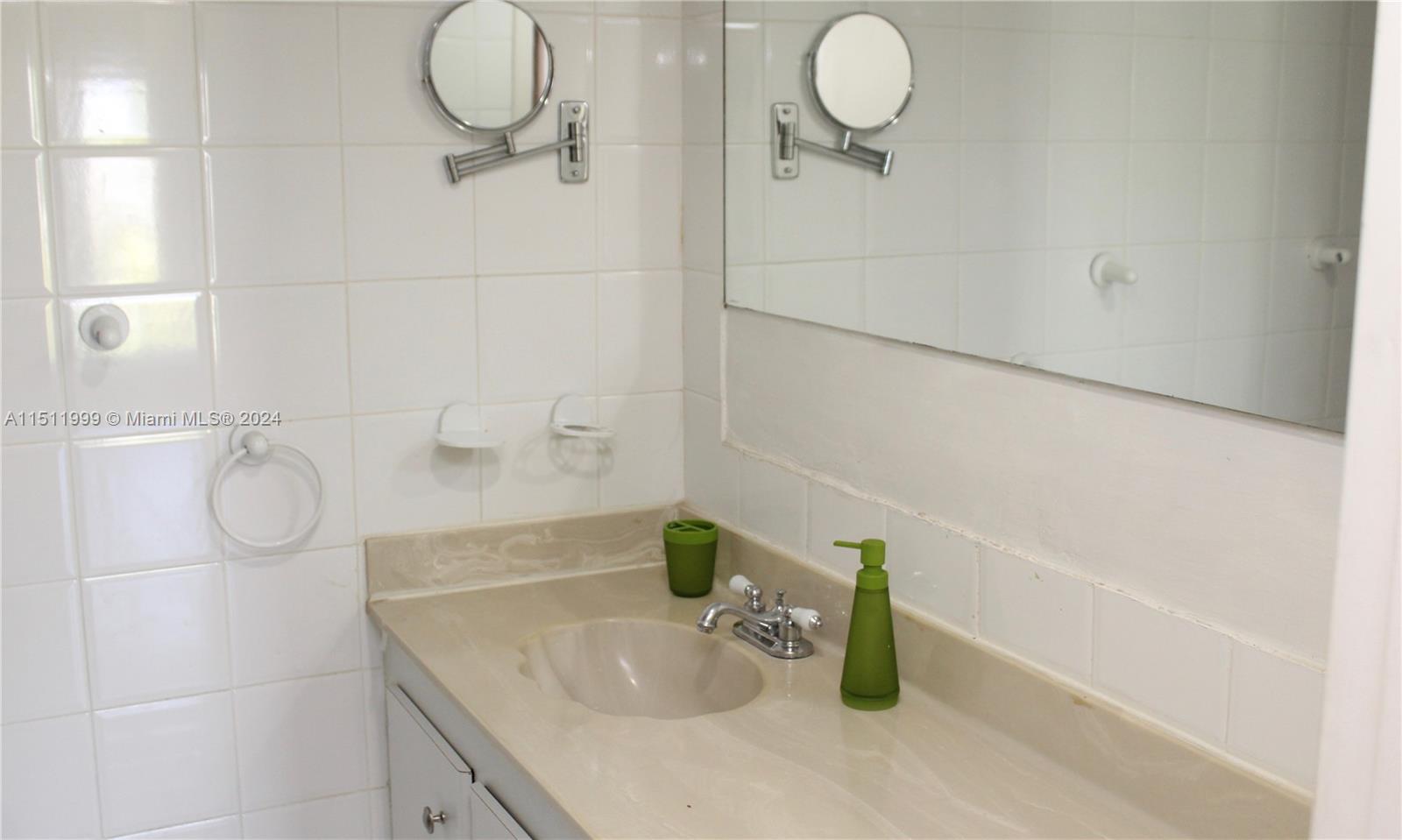 10433 Southwest 80th Street Miami, FL 33173 - Photo 16 of 24 a bathroom with a sink