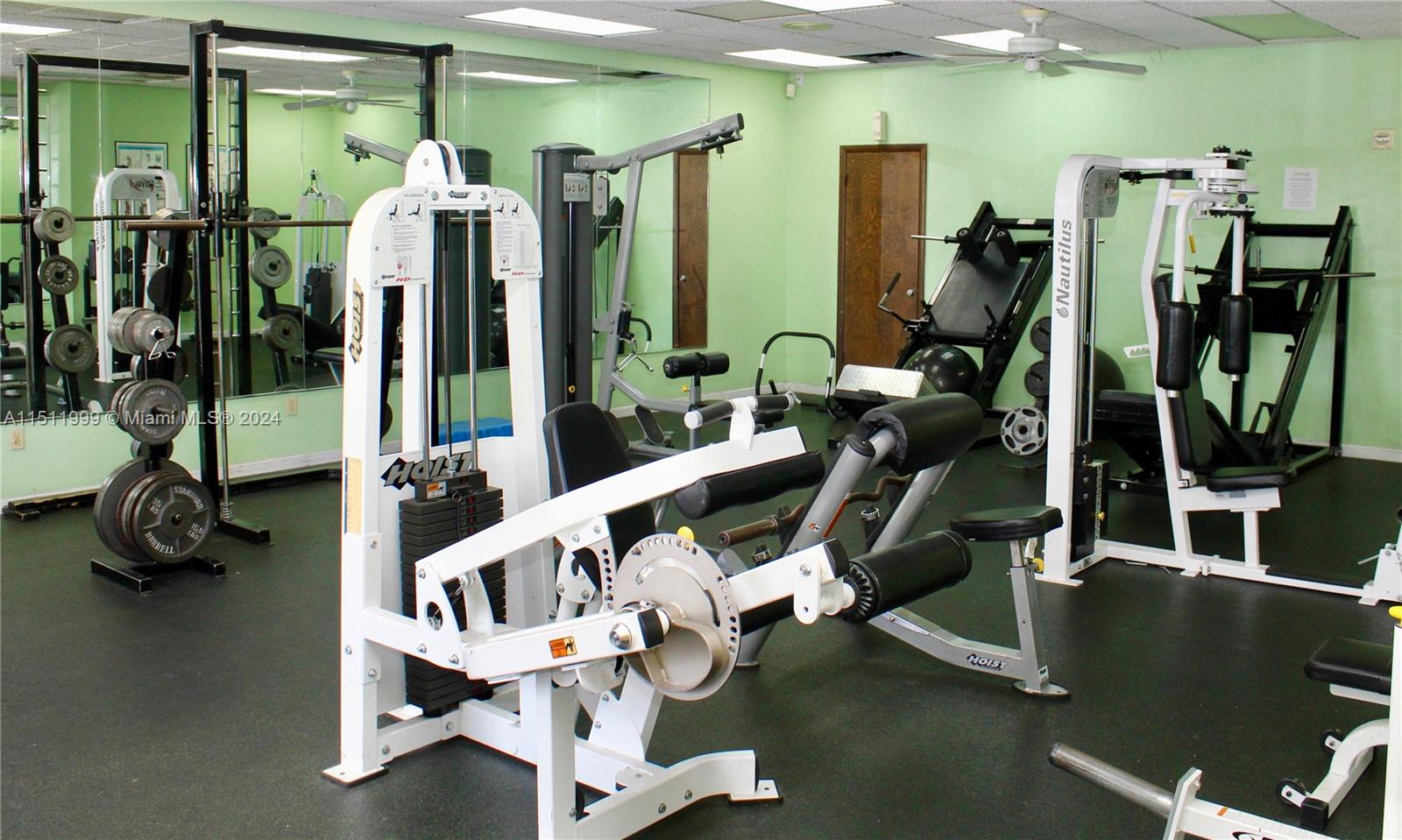 10433 Southwest 80th Street Miami, FL 33173 - Photo 22 of 24 a view of a room with gym equipment