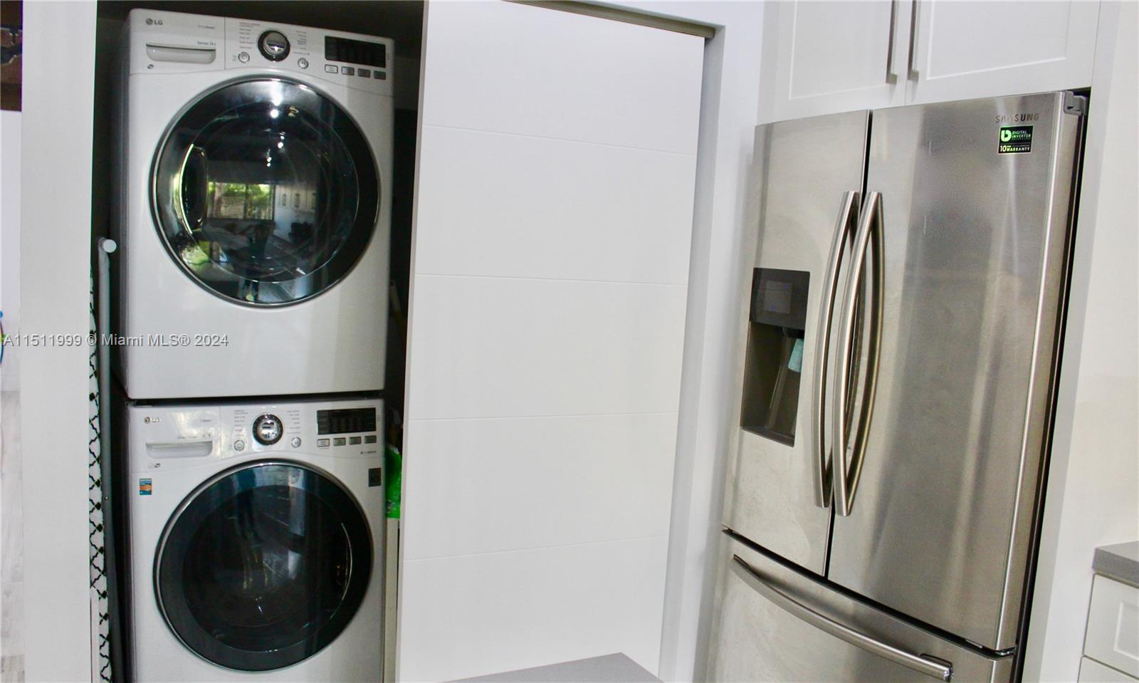 10433 Southwest 80th Street Miami, FL 33173 - Photo 5 of 24 a close view of a utility room with washer and dryer