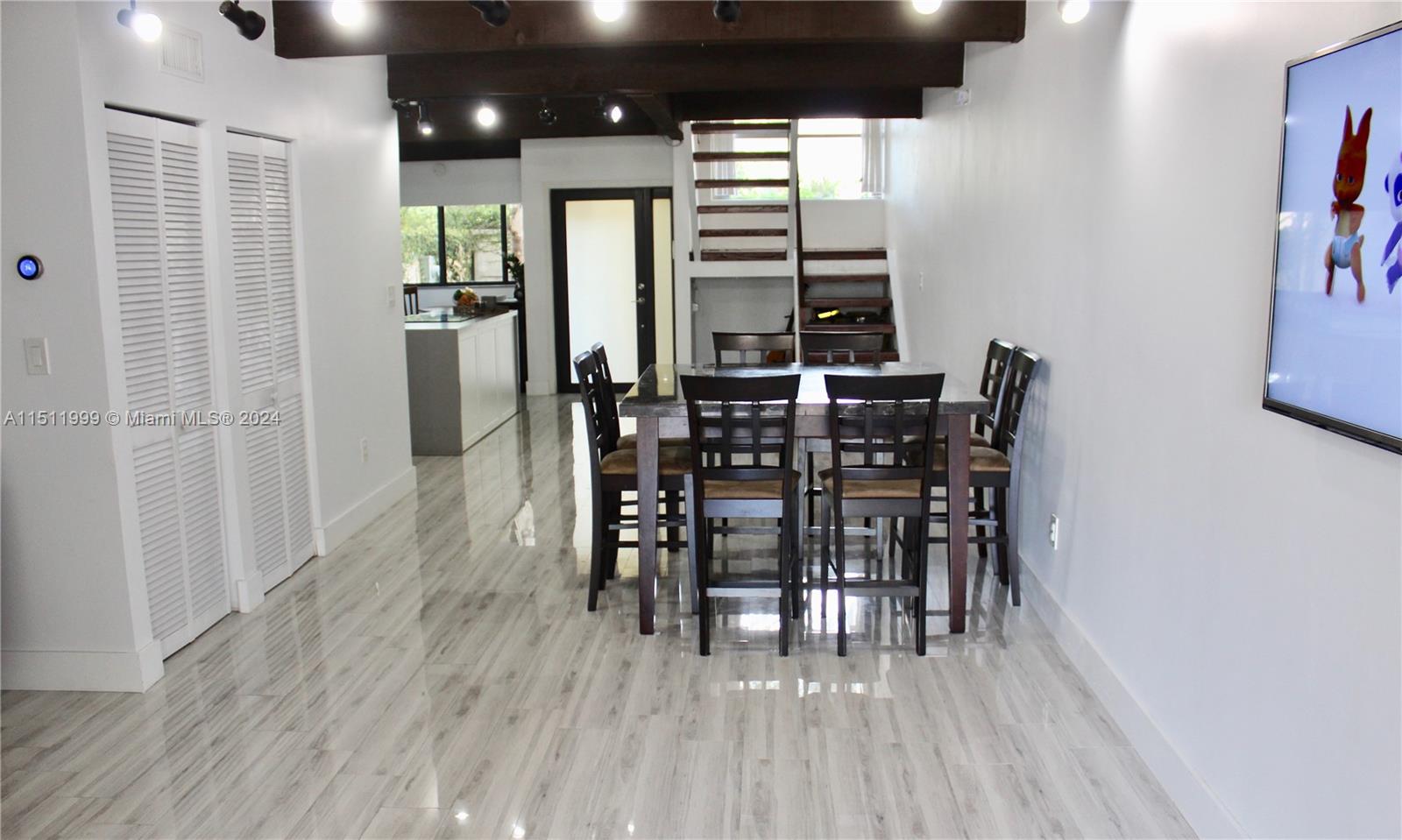 10433 Southwest 80th Street Miami, FL 33173 - Photo 6 of 24 a view of a a dining room with furniture and wooden floor