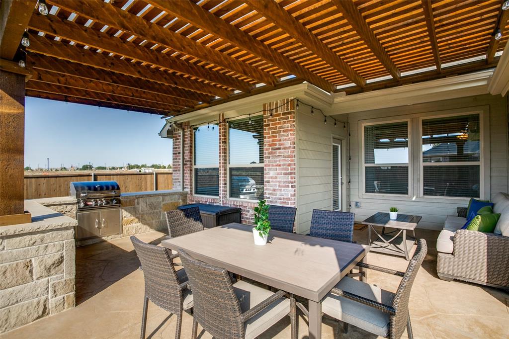 a outdoor dining space with furniture and outdoor view