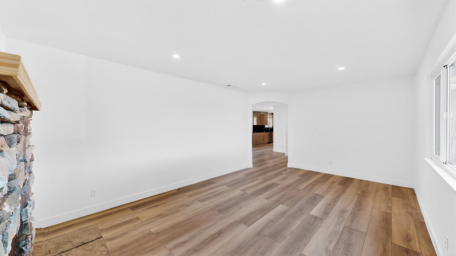 1611 East Olive Avenue Merced, CA 95340 - Photo 12 of 43 a view of empty room with wooden floor