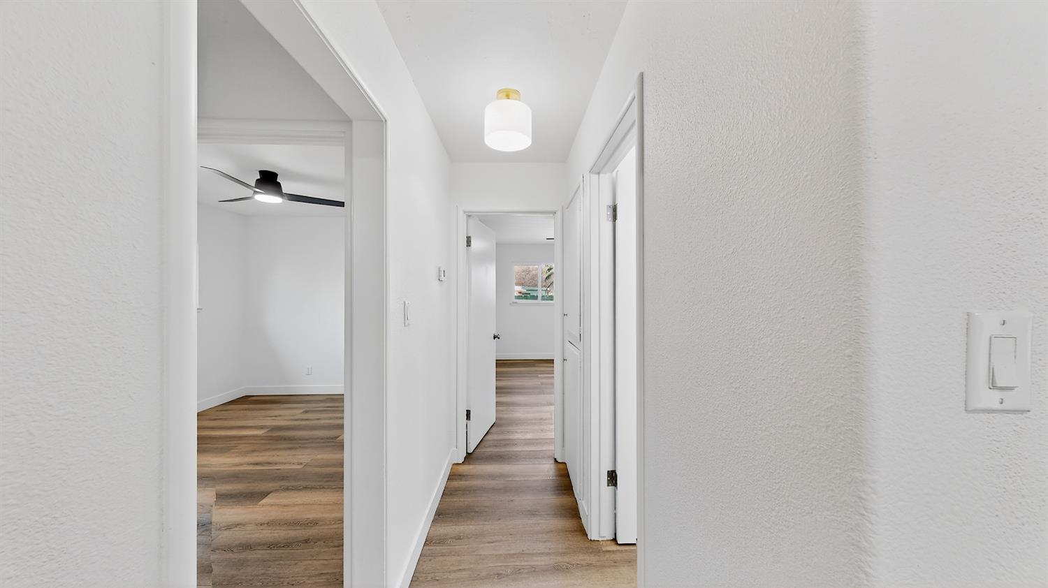 1611 East Olive Avenue Merced, CA 95340 - Photo 20 of 43 a view of a hallway with wooden floor