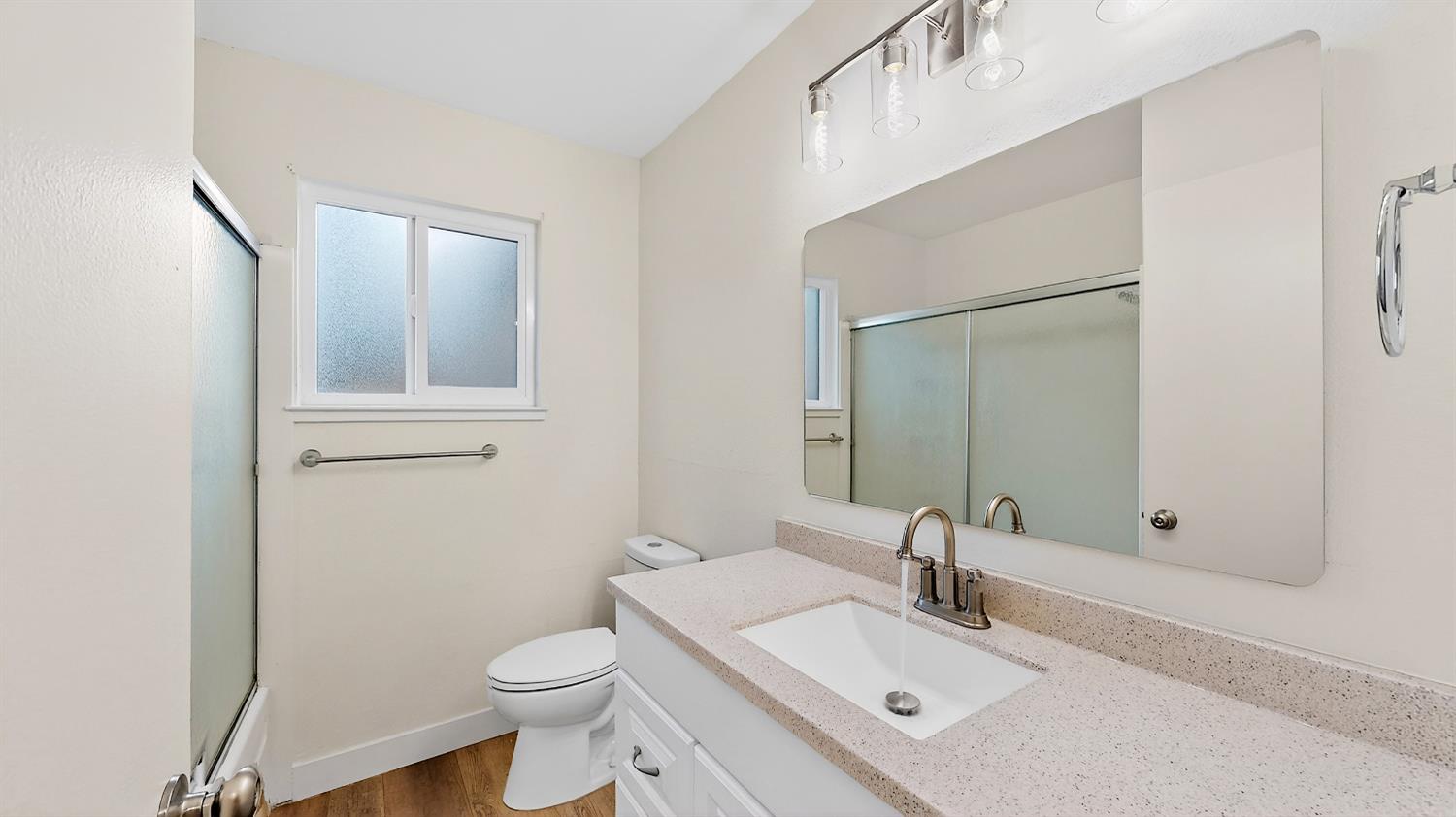 1611 East Olive Avenue Merced, CA 95340 - Photo 21 of 43 a bathroom with a sink toilet and mirror