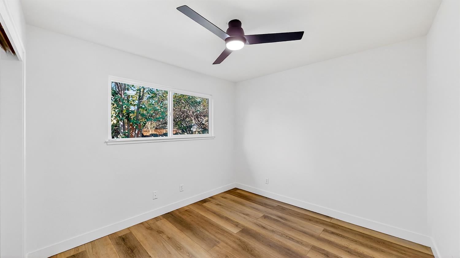1611 East Olive Avenue Merced, CA 95340 - Photo 24 of 43 a view of empty room with windows
