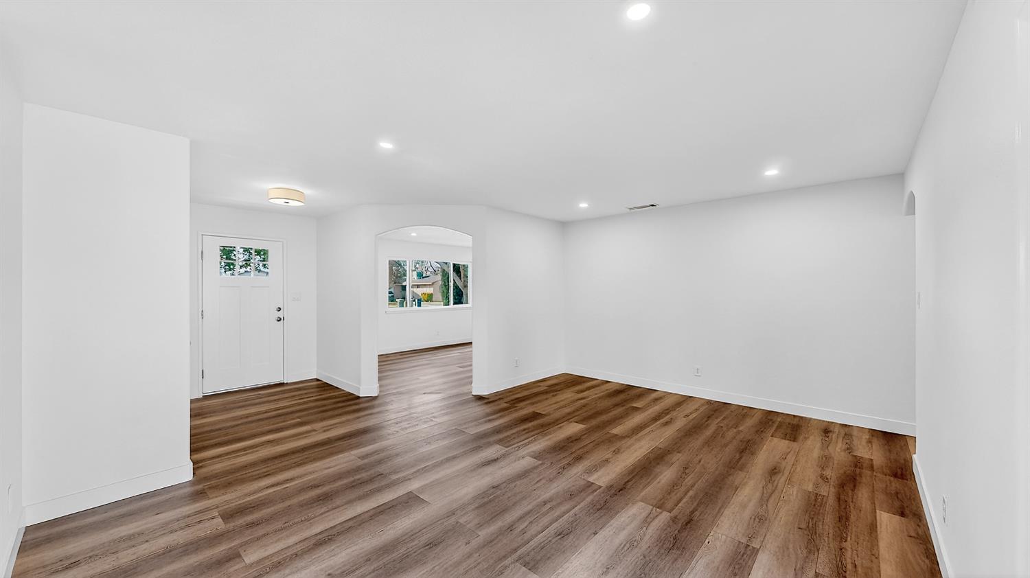 1611 East Olive Avenue Merced, CA 95340 - Photo 8 of 43 a view of empty room with wooden floor