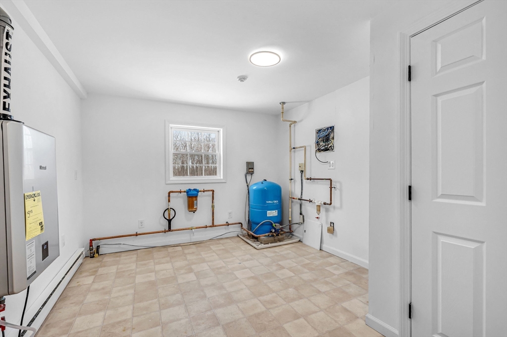 338 Daniel Shays Highway Pelham, MA 01002 - Photo 27 of 41 a view of a livingroom with furniture and a window