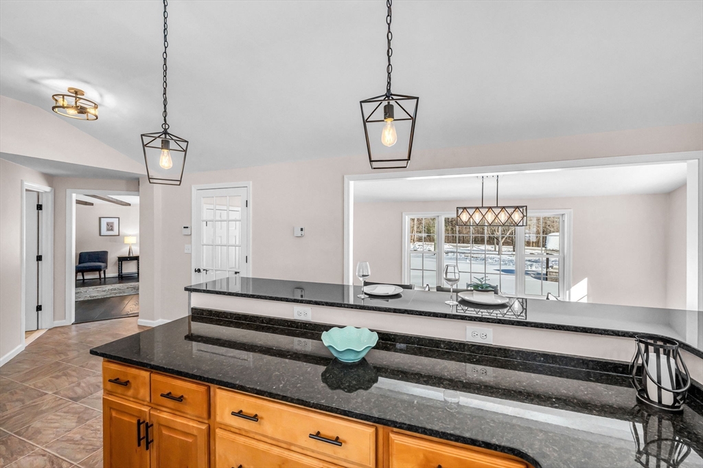 338 Daniel Shays Highway Pelham, MA 01002 - Photo 7 of 41 a kitchen with cabinets and chandelier
